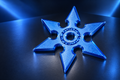 Vibrant blue Fidget Ninja Star with a six-point design and center ring